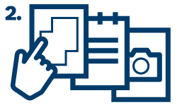 A hand taps on a graphic image on a screen.