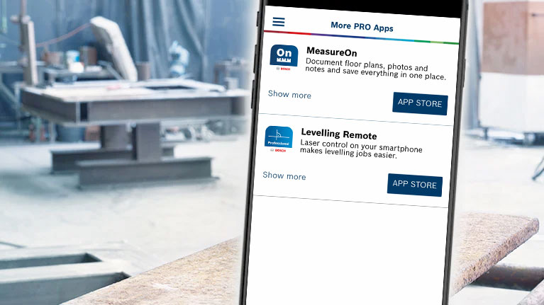Smartphone with Bosch apps in a workshop environment.