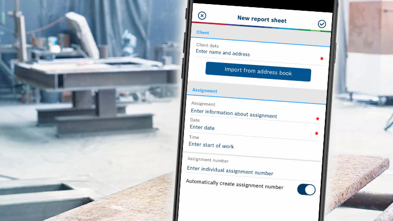 A smartphone displays a digital worksheet in a workshop.