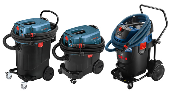 Three Bosch Professional vacuum cleaners in blue and black, on wheels.