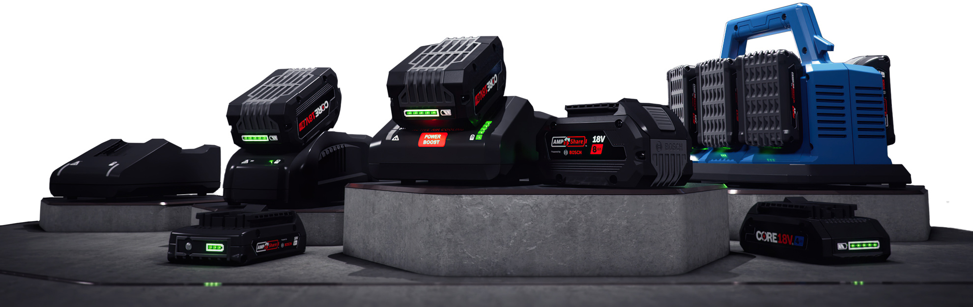 Black Bosch batteries on a gray pedestal, blue charger in the background.