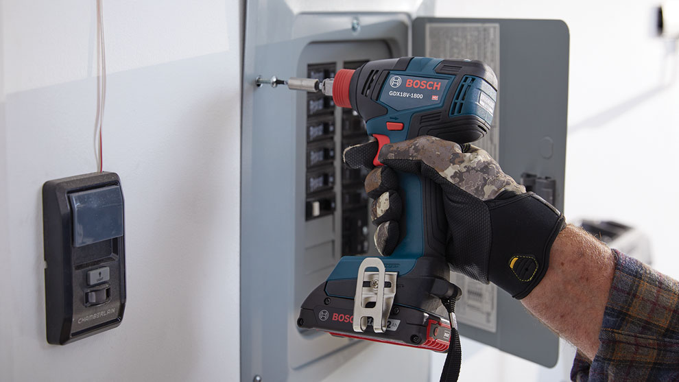 Bosch Professional cordless screwdriver is used at a distribution box.